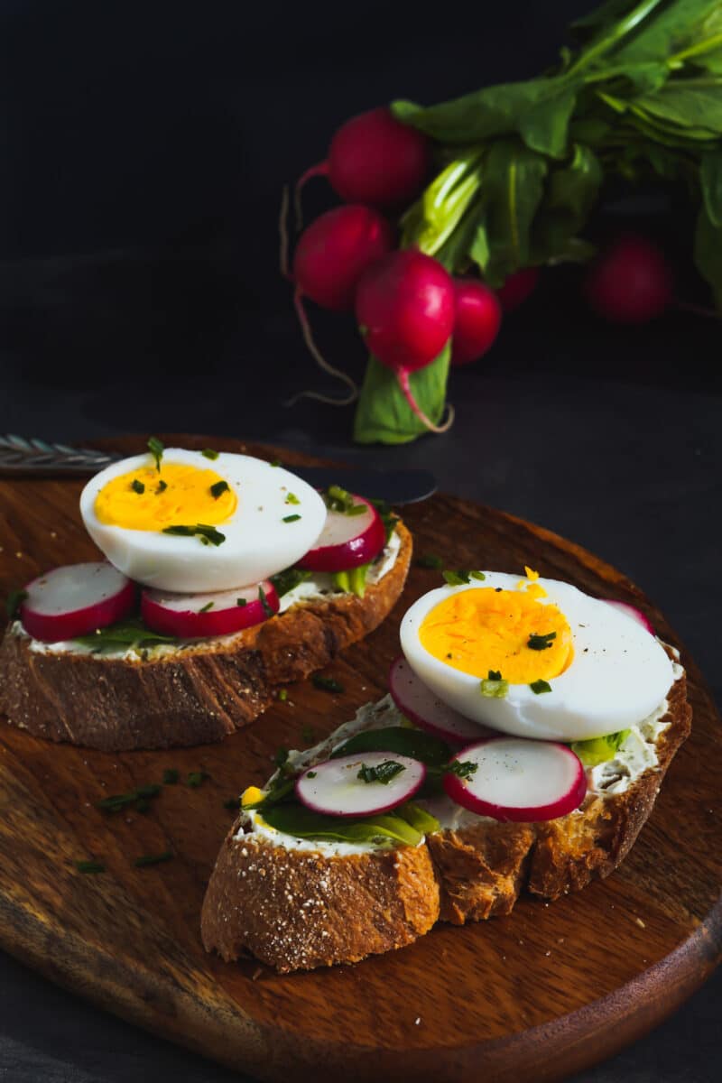 Spring Bruschetta With Radishes, lettuce, herby cream cheese and an egg