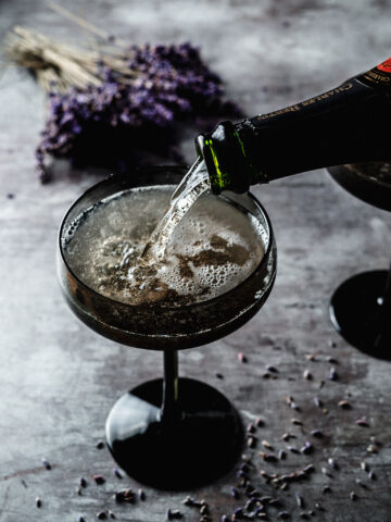 Lavender French 75 pouring